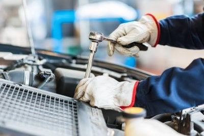 Mechanic Repairing a Car